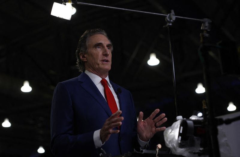 © Reuters. FILE PHOTO: North Dakota Governor Doug Burgum speaks in the spin room, ahead of the debate between Republican presidential nominee and former U.S. President Donald Trump and Democratic presidential nominee and U.S. Vice President Kamala Harris, in Philadelphia, Pennsylvania, U.S., September 10, 2024. REUTERS/Evelyn Hockstein/File Photo