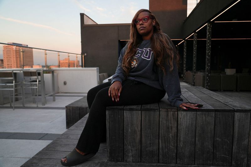 © Reuters. Monet Miller, an entertainment publicist, sits for a portrait at her residence in Atlanta. Georgia, U.S., November 8, 2024. REUTERS/Alyssa Pointer