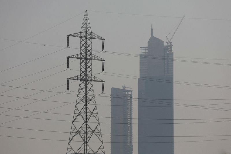 &copy; Reuters. FILE PHOTO: A power transmission tower is seen, with the Bharia Icon Tower in the background, a day after a country-wide power breakdown, in Karachi, Pakistan, January 24, 2023. REUTERS/Akhtar Soomro/File Photo