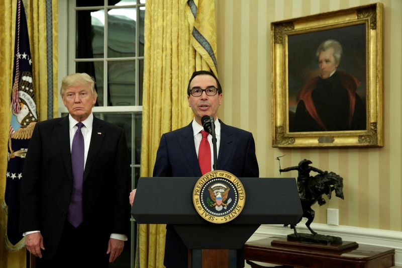 &copy; Reuters. FILE PHOTO: Steve Mnuchin speaks next to U.S. President Donald Trump after being sworn in as Treasury Secretary in the Oval Office of the White House in Washington February 13, 2017. REUTERS/Yuri Gripas/File Photo