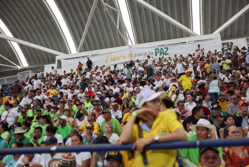 © Reuters. A sign reading “Land for Peace” is seen during an event of the Colombian presidency to handover of thousands of acres of land, once taken over by paramilitaries, as reparations for victims of the country's six-decade-long conflict, in Monteria, Colombia October 3, 2024. REUTERS/Luisa Gonzalez