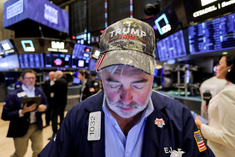 &copy; Reuters. FILE PHOTO: A trader wears a hat in support of Republican Donald Trump, after he won the U.S. presidential election, at the New York Stock Exchange (NYSE) in New York City, U.S., November 6, 2024. REUTERS/Andrew Kelly/File Photo