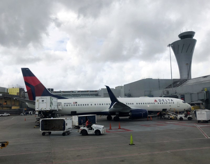 &copy; Reuters. FILE PHOTO: A Delta Airlines Boeing 737-900ER airplane is seen at SFO airport in San Francisco, California, U.S., March 28, 2019. REUTERS/Lucy Nicholson/File Photo