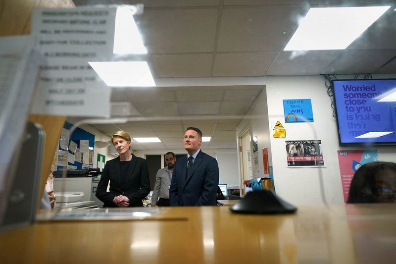 © Reuters. FILE PHOTO: Britain's Health Secretary Wes Streeting with Amanda Pritchard, Chief Executive of NHS England, during a visit to the Abbey Medical Centre in Abbey Wood, London, Britain. Picture date: Monday, July 8, 2024. Yui Mok/Pool via REUTERS/File Photo