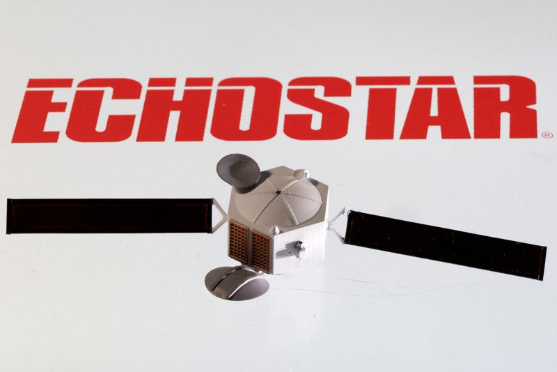 &copy; Reuters. A satellite model is placed on EchoStar Satellite Services logo in this picture illustration taken April 4, 2022. REUTERS/Dado Ruvic/Illustration/File Photo