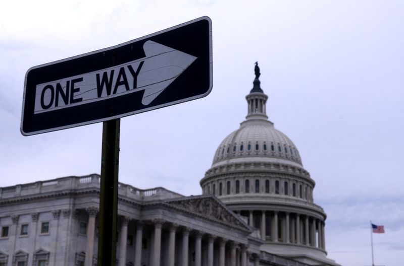 © Reuters. FILE PHOTO: A sign that reads 'One Way' stands in front of the U.S. Capitol building in Washington, US, November 10, 2024. REUTERS/Hannah McKay/File Photo