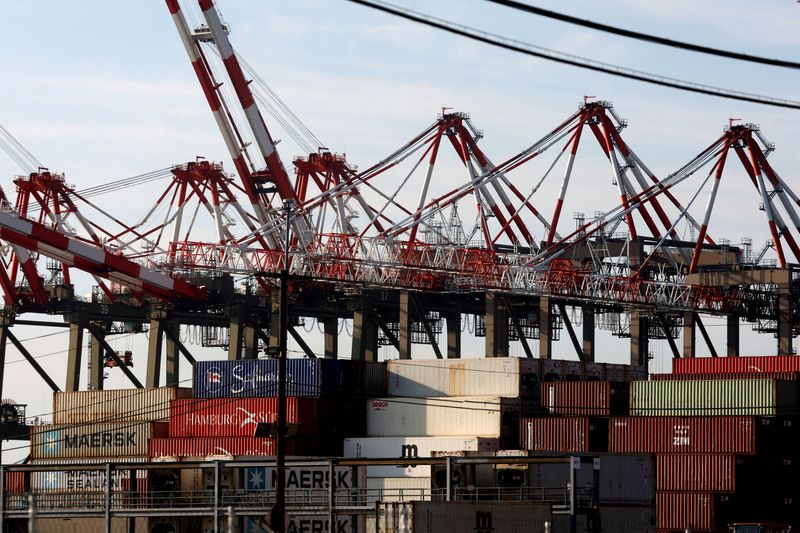 &copy; Reuters. FILE PHOTO: Containers are stacked beneath cranes at Port Newark Container Terminal as U.S. East Coast and Gulf ports resumed operations Friday after unionised dockworkers reached a tentative labour agreement with an employer group for a new contract, end