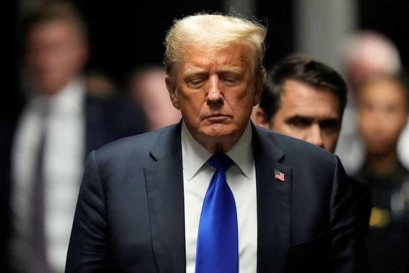 © Reuters. FILE PHOTO: Donald Trump walks to make comments to members of the media after being found guilty on 34 felony counts of falsifying business records in the first degree at Manhattan Criminal Court, Thursday, May 30, 2024, in New York. Seth Wenig/Pool via REUTERS/FILE PHOTO