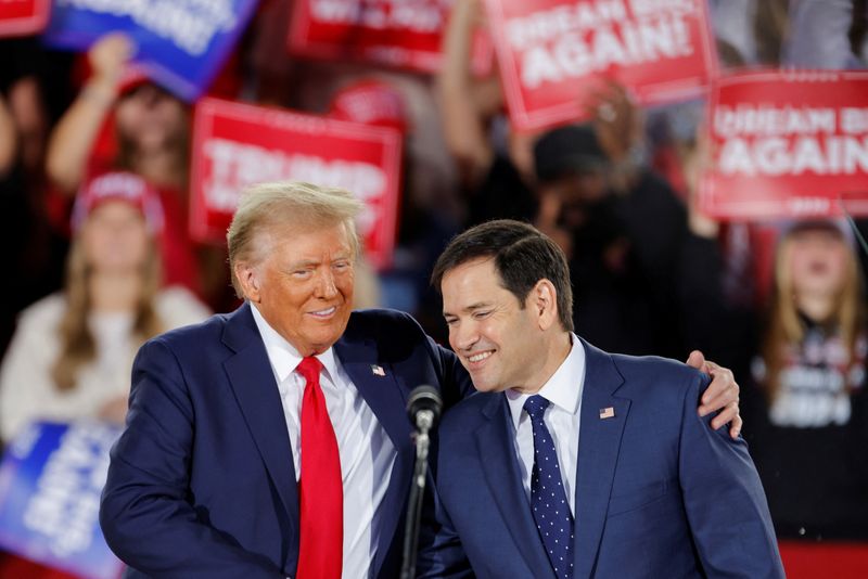  Donald Trump and Senator Marco Rubio (R-FL) react during a campaign event at Dorton Arena, in Raleigh, North Carolina, U.S. November 4, 2024. REUTERS/Jonathan Drake/File Photo