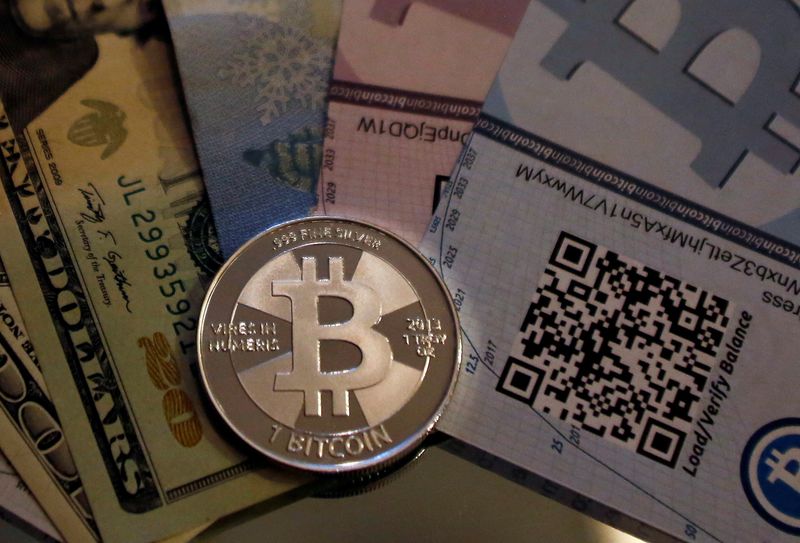 &copy; Reuters. FILE PHOTO: One of Bitcoin enthusiast Mike Caldwell's coins in this photo illustration at his office in Sandy, Utah, September 17, 2013. REUTERS/Jim Urquhart/File Photo