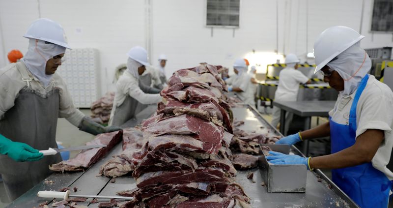 &copy; Reuters. FILE PHOTO: Employees work at the assembly line of jerked beef at a plant of JBS S.A, the world's largest beef producer, in Santana de Parnaiba, Brazil December 19, 2017. REUTERS/Paulo Whitaker/File Photo