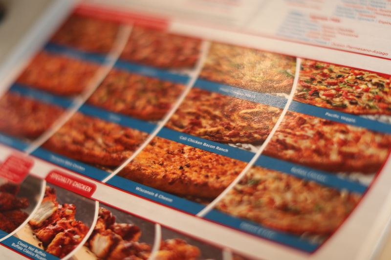 © Reuters. FILE PHOTO: A menu is displayed at Domino's Pizza restaurant in Los Angeles, California, U.S. July 18, 2018. REUTERS/Lucy Nicholson/File Photo