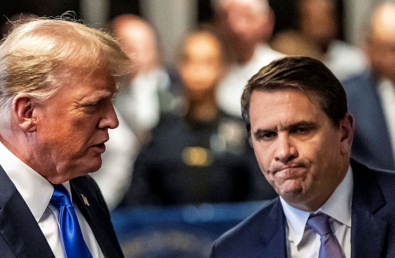 &copy; Reuters. FILE PHOTO: Former U.S. President Trump walks alongside his attorney Todd Blanche in New York, New York, U.S., 30 May 2024. Mark Peterson/Pool via REUTERS/File Photo