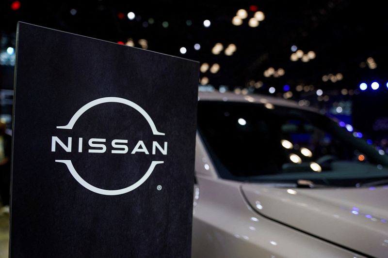 © Reuters. FILE PHOTO: A Nissan logo is seen next to a vehicle during the New York International Auto Show, in Manhattan, New York City, U.S., April 5, 2023. REUTERS/David 'Dee' Delgado/File Photo