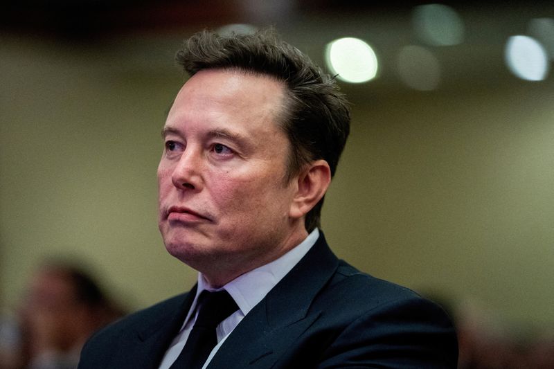 &copy; Reuters. FILE PHOTO: Tesla CEO and X owner Elon Musk listens as US President-elect Donald Trump speaks during a meeting with House Republicans at the Hyatt Regency hotel in Washington, DC, U.S. on November 13, 2024. ALLISON ROBBERT/Pool via REUTERS/File Photo