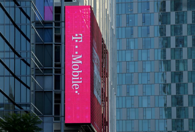 &copy; Reuters. FILE PHOTO: A T-Mobile logo is advertised on a building sign in Los Angeles, California, U.S., May 11, 2017. REUTERS/Mike Blake/File Photo 