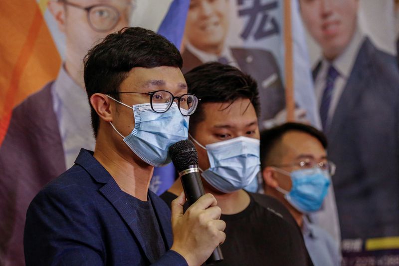 © Reuters. Political activist Ventus Lau Wing-hong speaks to the media after he was disqualified from running for election for the legislature in Hong Kong, China July 30, 2020. REUTERS/Tyrone Siu/File Photo