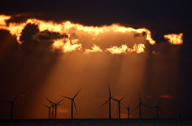 &copy; Reuters. FILE PHOTO: The sun sets behind wind turbines at the Saint-Nazaire offshore wind farm, off the coast of the Guerande peninsula in western France, February 25, 2023. REUTERS/Stephane Mahe