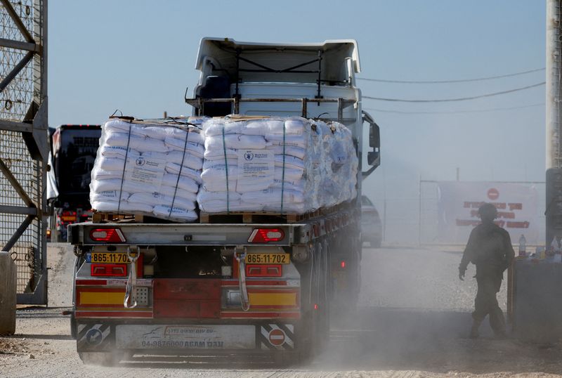 &copy; Reuters. FILE PHOTO: A truck carries humanitarian aid destined for the Gaza Strip, amid the ongoing conflict in Gaza between Israel and Hamas, at the Kerem Shalom crossing in southern Israel, November 11, 2024. REUTERS/Amir Cohen/File Photo