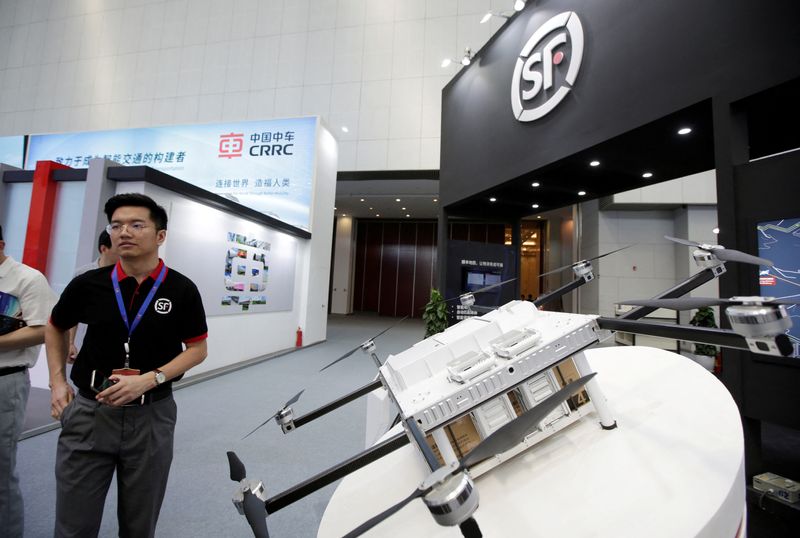 © Reuters. FILE PHOTO: A delivery drone is displayed at SF Express's booth at an exhibition during the World Intelligence Congress in Tianjin, China May 16, 2019. REUTERS/Jason Lee/File Photo