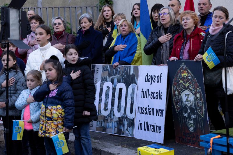 © Reuters. FILE PHOTO: Protesters gather to participate in a demonstration marking the upcoming anniversary of 1,000 days since Russia's invasion of Ukraine, near the Russian Embassy in Rome, Italy, November 17, 2024. REUTERS/Remo Casilli/File Photo