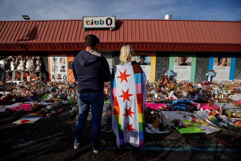 &copy; Reuters. FILE PHOTO: People look at he flowers and mementos left at a memorial after a mass shooting at LGBTQ nightclub Club Q in Colorado Springs, Colorado, U.S. November 26, 2022.  REUTERS/Isaiah J. Downing/File Photo