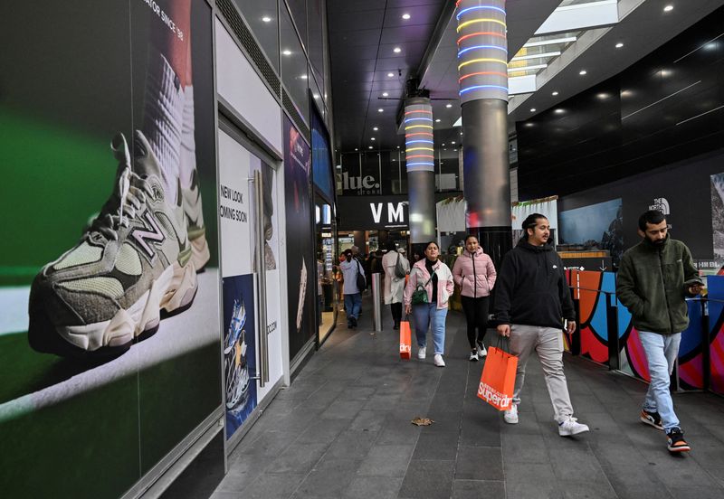 © Reuters. FILE PHOTO: Shoppers walk out of a mall in Sydney's CBD in Sydney, Australia, July 3, 2024. REUTERS/Jaimi Joy/File Photo