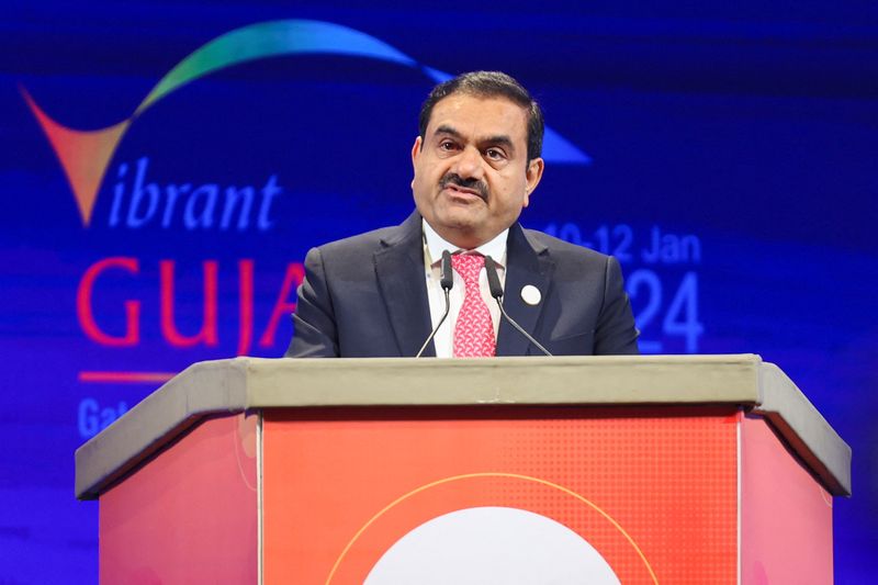 © Reuters. FILE PHOTO: Chairperson of Adani Group Gautam Adani speaks during the Vibrant Gujarat Global Summit, at the Mahatma Mandir in Gandhinagar, Gujarat, India January 10, 2024. REUTERS/Amit Dave/File Photo