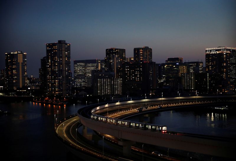 &copy; Reuters. FILE PHOTO: A train of the Yurikamome line, a driverless automatic train system, runs with the city skyline in the background, in Tokyo, Japan, April 21, 2021. Picture taken April 21, 2021.  REUTERS/Kim Kyung-Hoon/File Photo