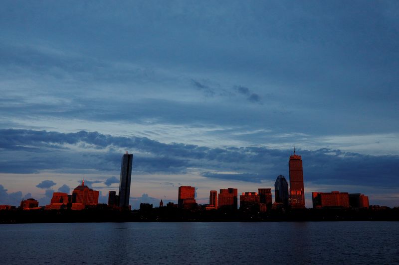 &copy; Reuters. FILE PHOTO: The setting sun reflects off the Boston skyline across the Charles River in Cambridge, Massachusetts, U.S., June 27, 2017.   REUTERS/Brian Snyder/File Photo