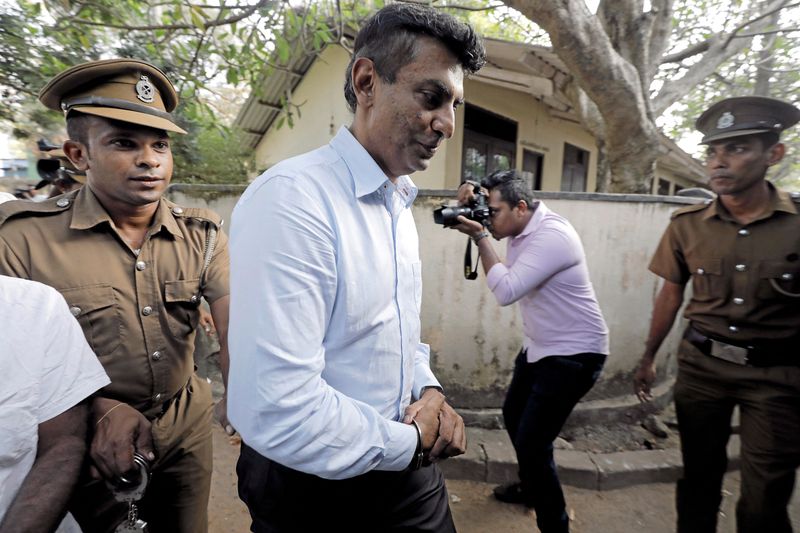 &copy; Reuters. FILE PHOTO: Former CEO of SriLankan Airlines, Kapila Chandrasena, leaves the court along with prison officers, after being remanded  in Colombo, Sri Lanka February 6, 2020. REUTERS/Dinuka Liyanawatte/File Photo