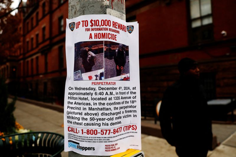 &copy; Reuters. An NYPD information poster hangs outside the New York International Hostel, where the suspect in the fatal shooting of CEO of UnitedHealthcare Brian Thompson is believed to have stayed, in the Upper West Side area of New York City, U.S., December 5, 2024.