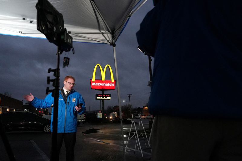 &copy; Reuters. A television reporter broadcasts from outside a McDonald's restaurant where a suspect in the killing UnitedHealth executive Brian Thompson, identified as Luigi Mangione, 26, was arrested in Altoona, Pennsylvania, U.S. December 9, 2024.  REUTERS/Julio Cesa