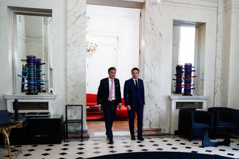 © Reuters. French President Emmanuel Macron walks next to First Secretary of the Socialist Party (PS) Olivier Faure after their meeting at the Elysee Palace in Paris, France, June 21, 2022. Mohammed Badra/Pool via REUTERS/File Photo