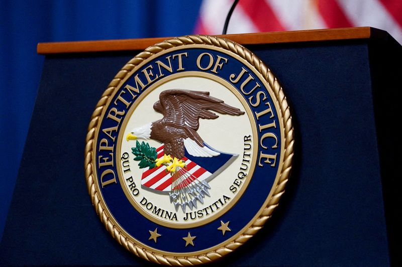 © Reuters. FILE PHOTO: The seal of the U.S. Department of Justice is seen on the podium in the briefing room at department headquarters before a news conference with the attorney general in Washington, January 24, 2023. REUTERS/Kevin Lamarque/File Photo