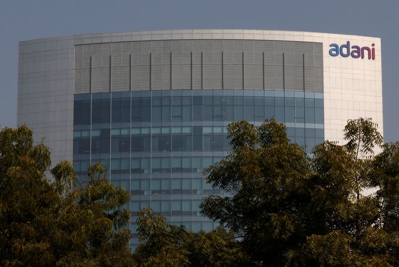 &copy; Reuters. FILE PHOTO: The logo of the Adani Group is seen on the facade of its Corporate House on the outskirts of Ahmedabad, India, November 22, 2024. REUTERS/Amit Dave/File Photo