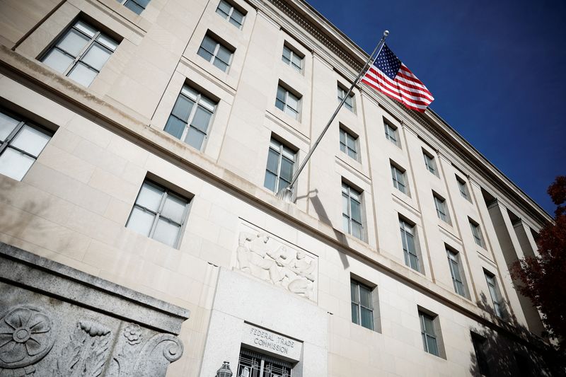 © Reuters. A U.S. flag flutters at the Federal Trade Commission (FTC) headquarters in Washington, D.C., U.S., November 24, 2024. REUTERS/Benoit Tessier/File Photo