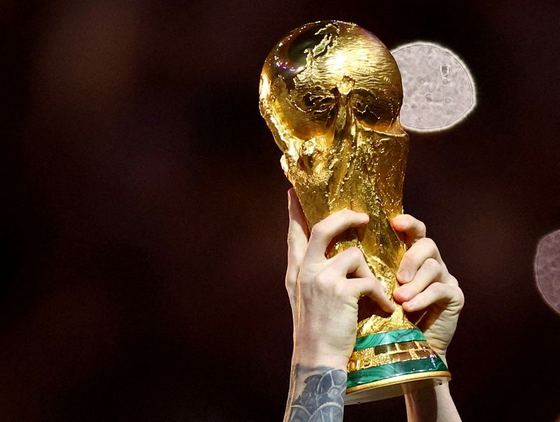 &copy; Reuters. FILE PHOTO: Soccer Football - FIFA World Cup Qatar 2022 - Final - Argentina v France - Lusail Stadium, Lusail, Qatar - December 18, 2022  General view of Argentina's Lionel Messi lifting the trophy as he celebrates winning the World Cup REUTERS/Hannah Mck