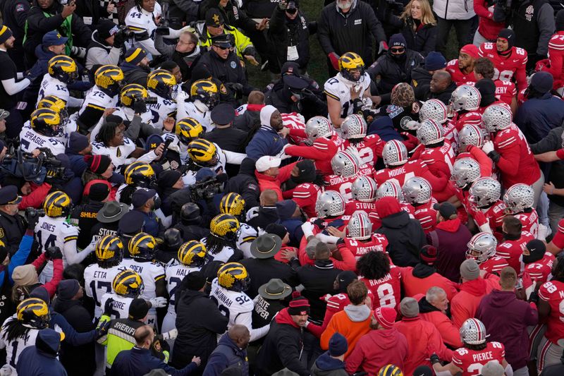 &copy; Reuters. Nov 30, 2024; Columbus, Ohio, USA; Michigan Wolverines and Ohio State Buckeyes fight following the NCAA football game at Ohio Stadium in Columbus on Saturday, Nov. 30, 2024. Michigan won 13-10. Mandatory Credit: Barbara J. Perenic-USA TODAY Network via Im