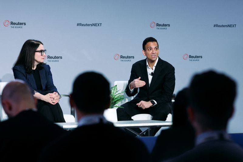 © Reuters. Vin Gupta, Chief Medical Officer of Amazon Pharmacy, speaks next to Caroline Roan, Chief Sustainability Officer & Head of Pfizer Foundation, during the Reuters NEXT conference, in New York City, New York, U.S., December 11, 2024. REUTERS/Brendan McDermid