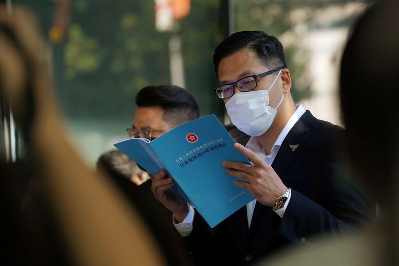 &copy; Reuters. FILE PHOTO: Democratic Party politician Lam Cheuk-ting reads the annual policy address outside the Legislative Council in Hong Kong, China November 25, 2020. REUTERS/Lam Yik/File Photo