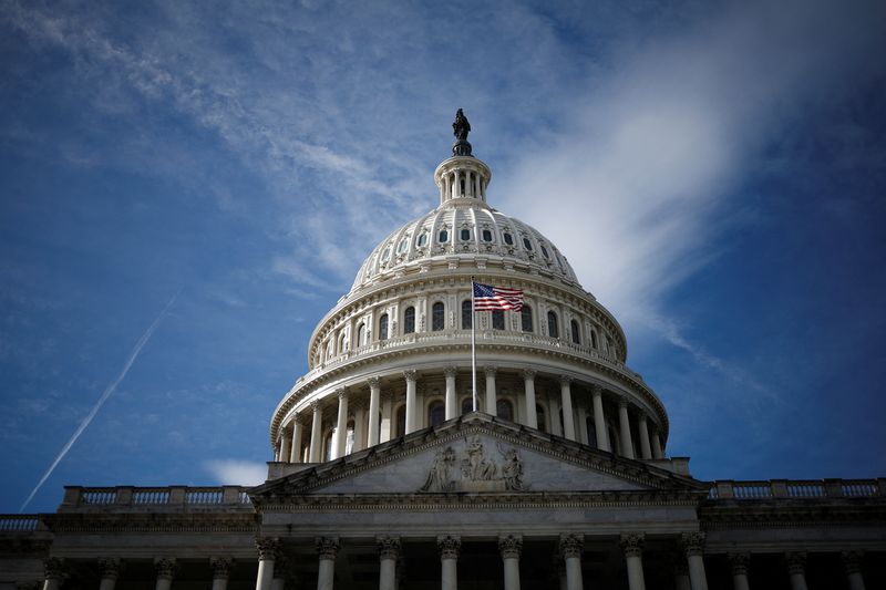 &copy; Reuters. FILE PHOTO: A U.S. flag is mounted on the U.S. Capitol in Washington, U.S., December 8, 2024. REUTERS/Benoit Tessier/File Photo