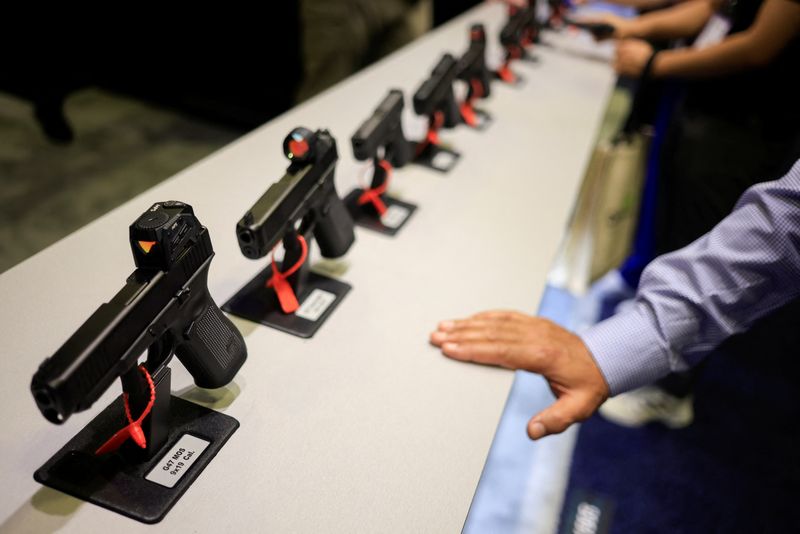 &copy; Reuters. FILE PHOTO: Handguns are displayed at the Glock, Inc. booth at Special Operations Forces (SOF) Week for defense companies, in Tampa, Florida, U.S., May 7, 2024.  REUTERS/Luke Sharrett/File Photo