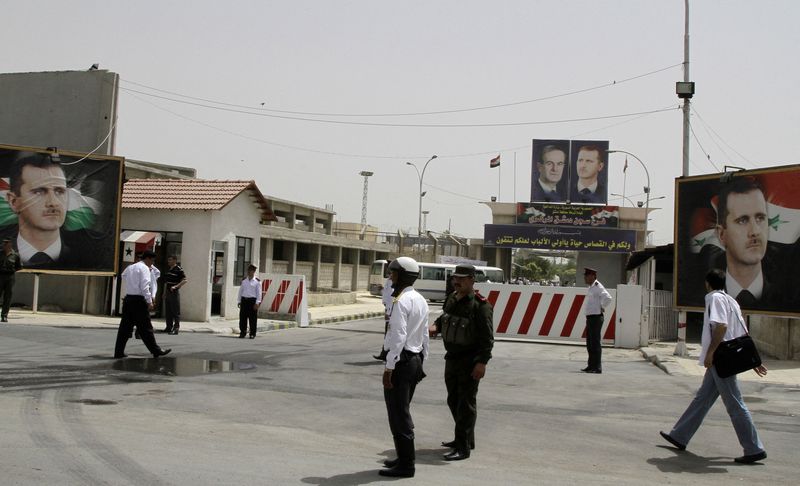 &copy; Reuters. FILE PHOTO: Police stand at the gate of Damascus Central Prison in the Adra area near the Syrian capital of Damascus in this May 28, 2010 file photo. REUTERS/Khaled al-Hariri/Files/File Photo