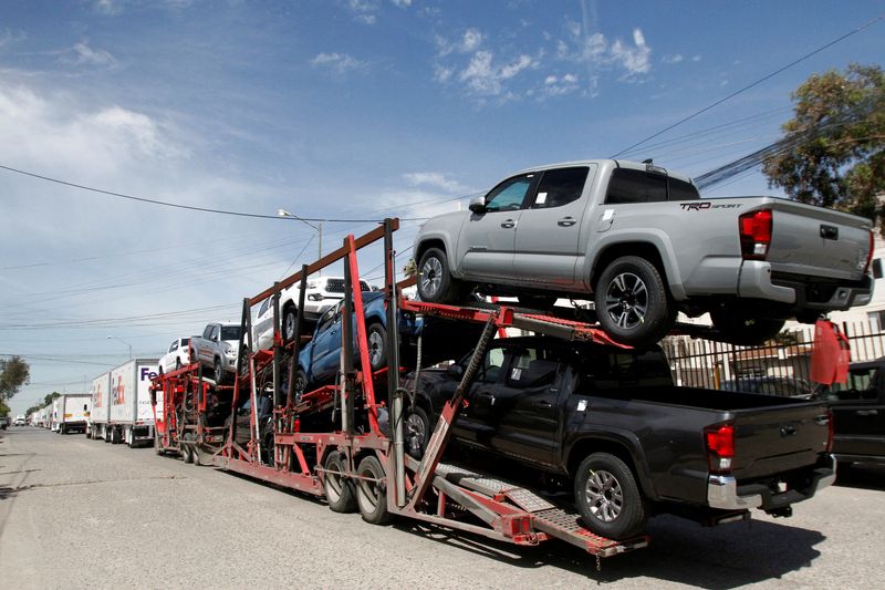 &copy; Reuters. FILE PHOTO: A car carrier transports Toyota trucks for delivery while waiting in queue for border customs control to cross into the U.S., at the Otay border crossing in Tijuana, Mexico April 8, 2019. REUTERS/Jorge Duenes/File Photo