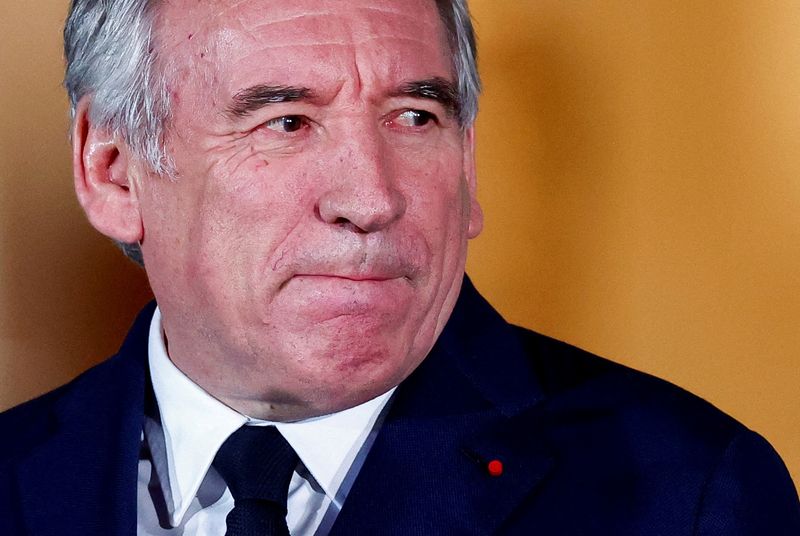 © Reuters. FILE PHOTO: New French Prime Minister François Bayrou reacts on the day of the handover ceremony at the Matignon hotel in Paris, France, December 13, 2024. REUTERS/Gonzalo Fuentes/File Photo