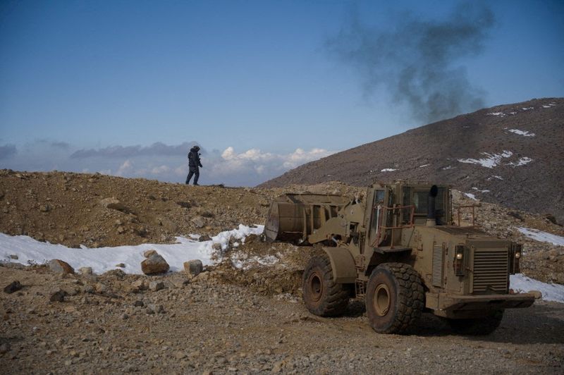 © Reuters. FILE PHOTO: Israeli forces operate at a location identified as the Jebel Hermon area, Syria, in this photo posted on December 9, 2024. Israel Defense Forces/Handout via Reuters/File photo