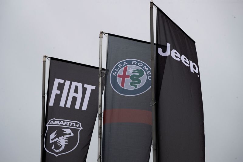 &copy; Reuters. FILE PHOTO: Banners showing logos of Fiat, Jeep, Abarth and Alfa Romeo are hung outside a car dealership in Milan, Italy, November 21, 2024. REUTERS/Alessandro Garofalo/File Photo