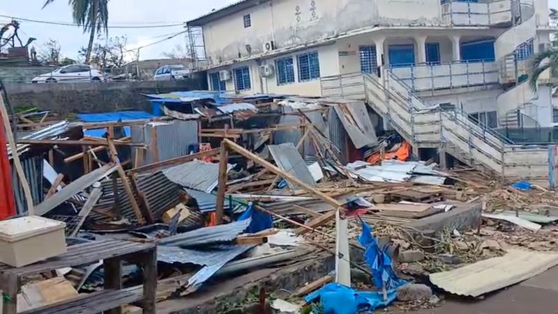 © Reuters. Debris is seen in the aftermath of Cyclone Chido, in Mamoudzou, Mayotte, France, December 15, 2024, in this screen grab obtained from video. John Balloz/via REUTERS 