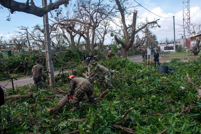 © Reuters. Army personnel work in the aftermath of Cyclone Chido, in Mayotte, France, December 16, 2024. Etat-major des armees/Handout via REUTERS    